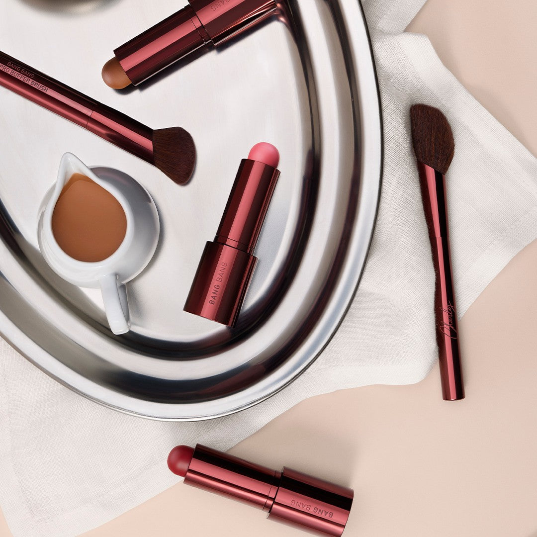 Three Bang Balms and two brushes from the Hôtel Charly collection, top view