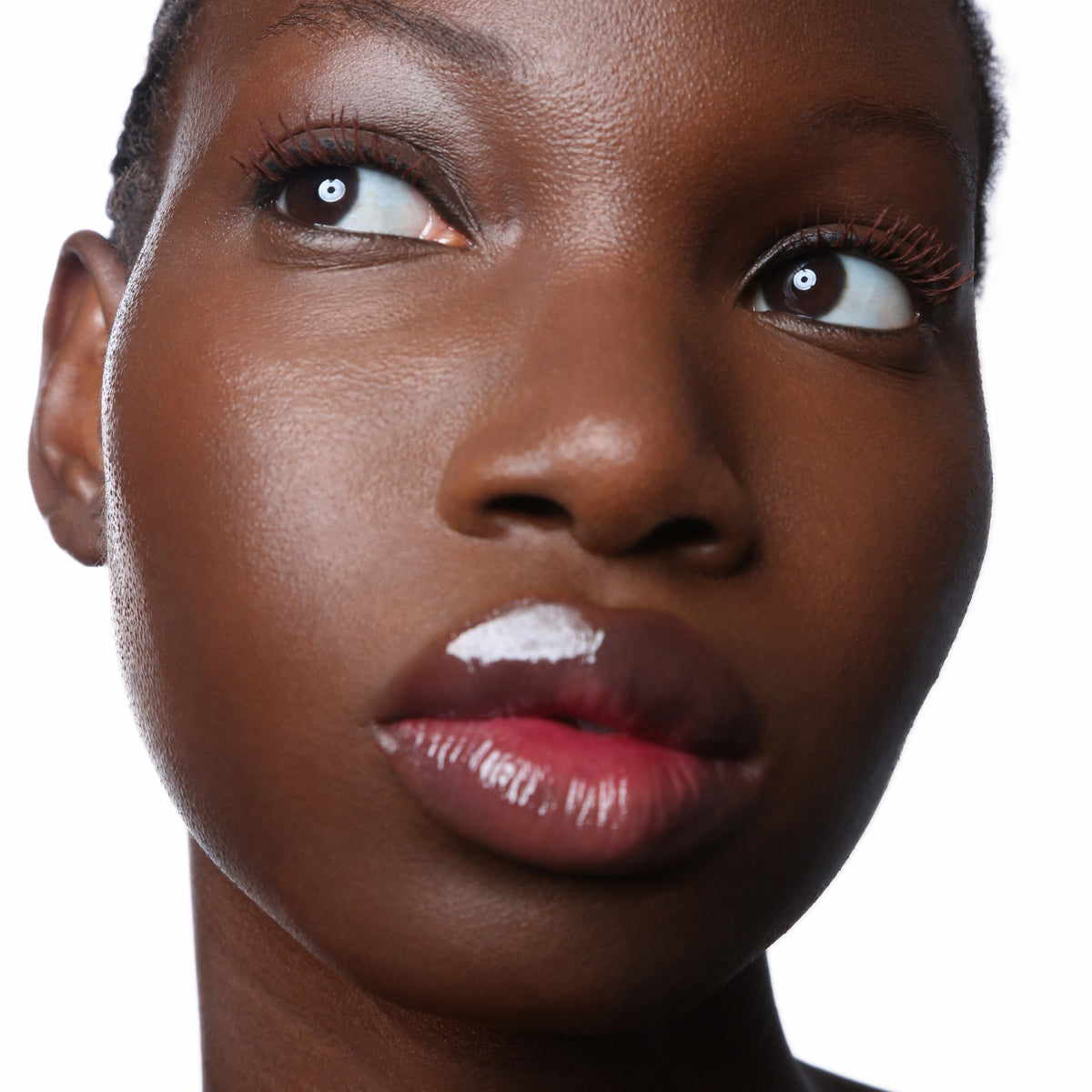 Banger Mascara Red Wine Rêverie, worn, looking up, with Bang Balm Coffee For Two on the cheeks