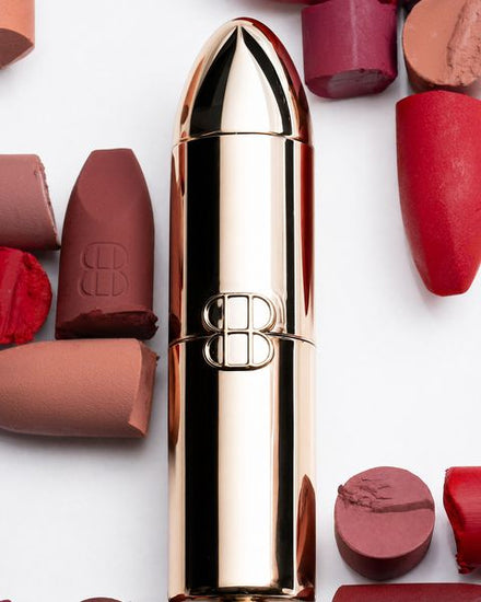 The golden bullet case lying among lipstick bullets